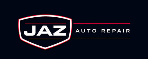 JAZ Auto Repair logo featuring a shield-shaped emblem with white text on dark background